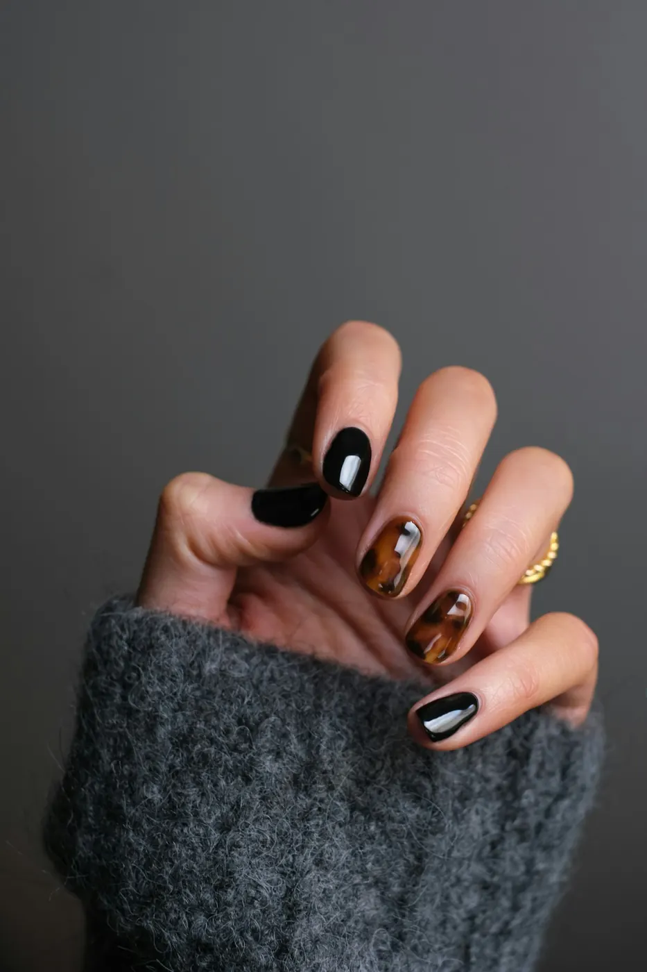 Gel nail art design on manicured hands